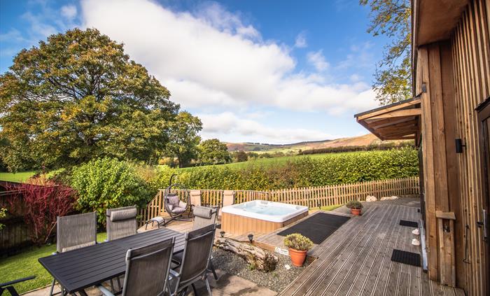 Relax on your private patio overlooking the fields and the countryside views.